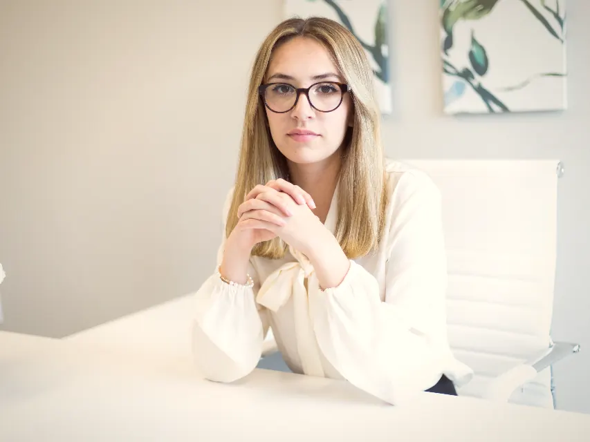 A consultancy founder at her desk, photographed for a website rewrite